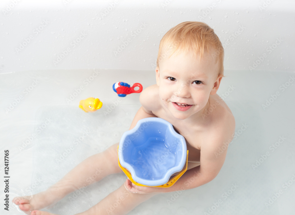 Baby in bath with toys Baby in bath with toys