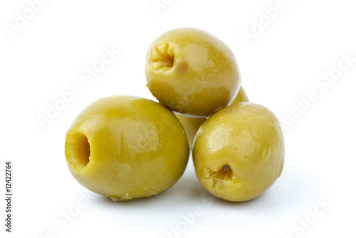 Three pitted marinated green olives close-up