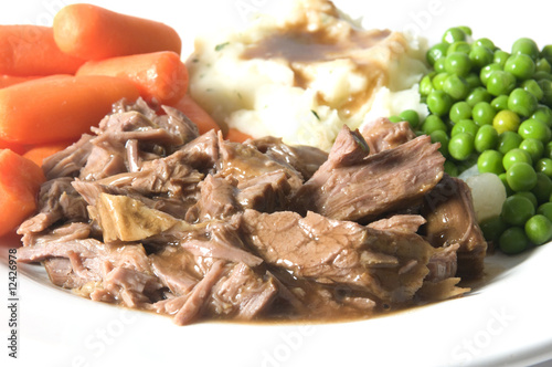 Obraz na plátně pot roast dinner mashed potatoes carrots green peas