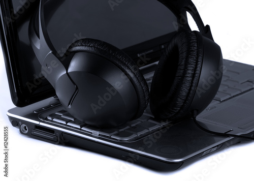 Close up of laptop and headphones © utflytter