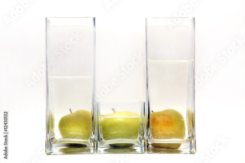 glass transparent vases and green apples