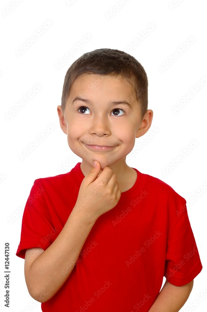Seven-year-old boy looking up thinking, isolated on white Seven-year-old boy looking up thinking, isolated on white