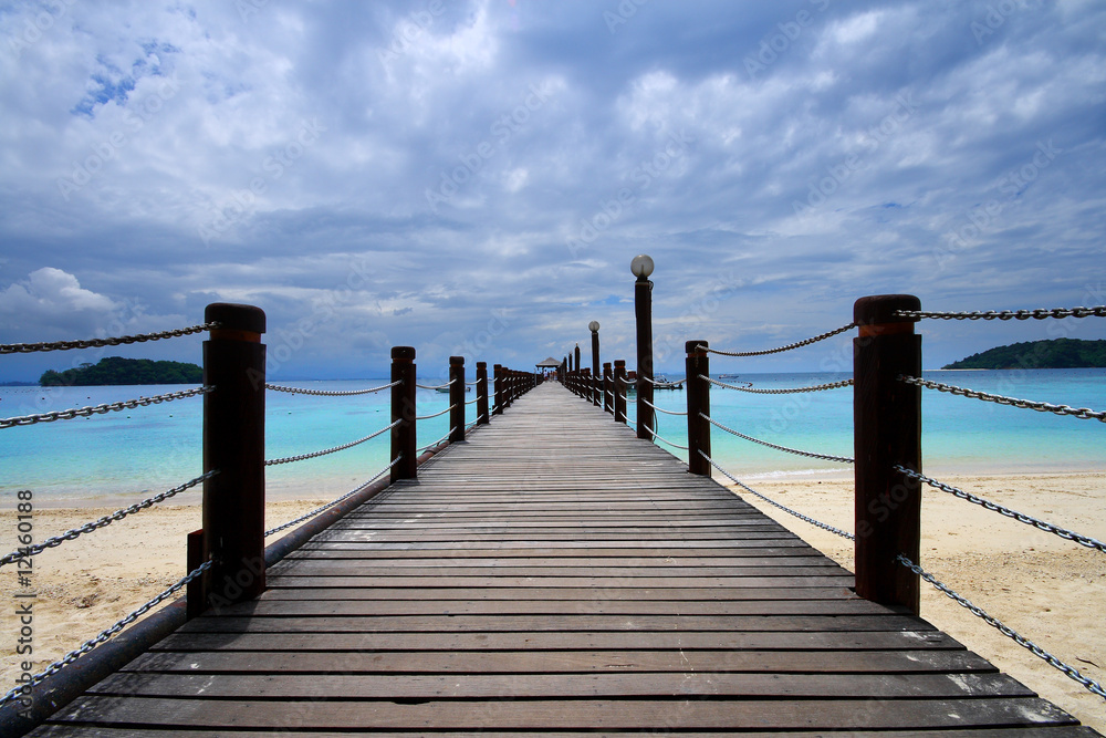 Footbridge over turquoise ocean Footbridge over turquoise ocean