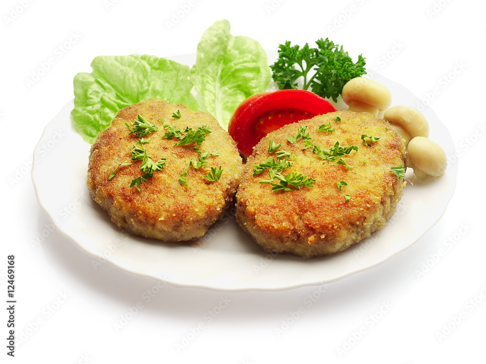 Fried meatballs decorated with mushrooms, salad, tomato... Fried meatballs decorated with mushrooms, salad, tomato...