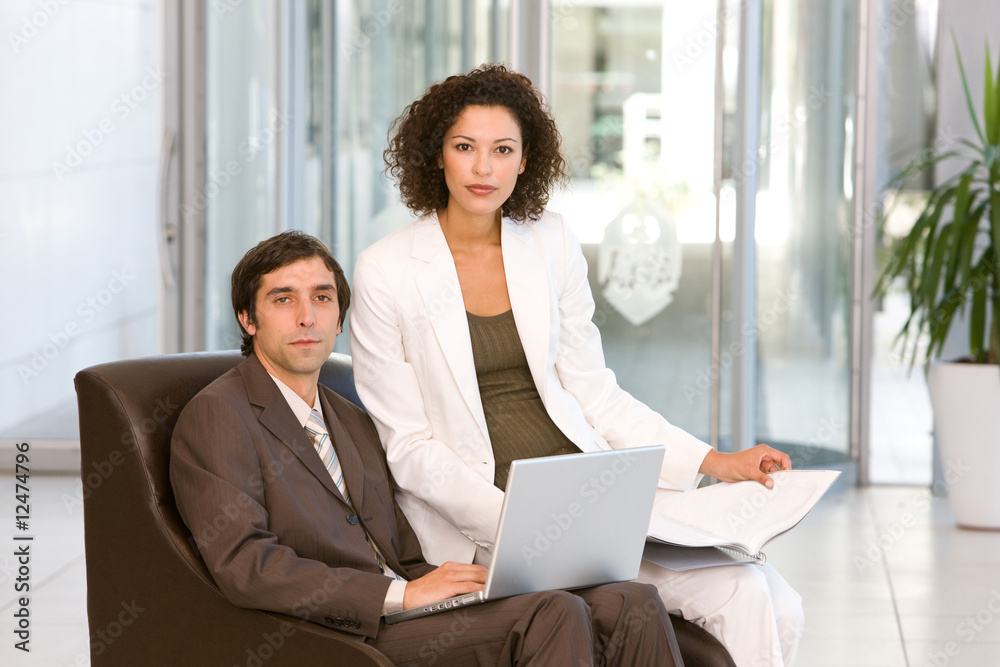 portrait of business executives working on laptop portrait of business executives working on laptop
