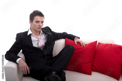 Young business man relaxing in couch