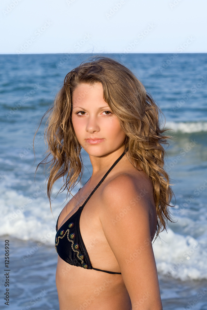 Portrait of the beautiful girl against the sea Portrait of the beautiful girl against the sea