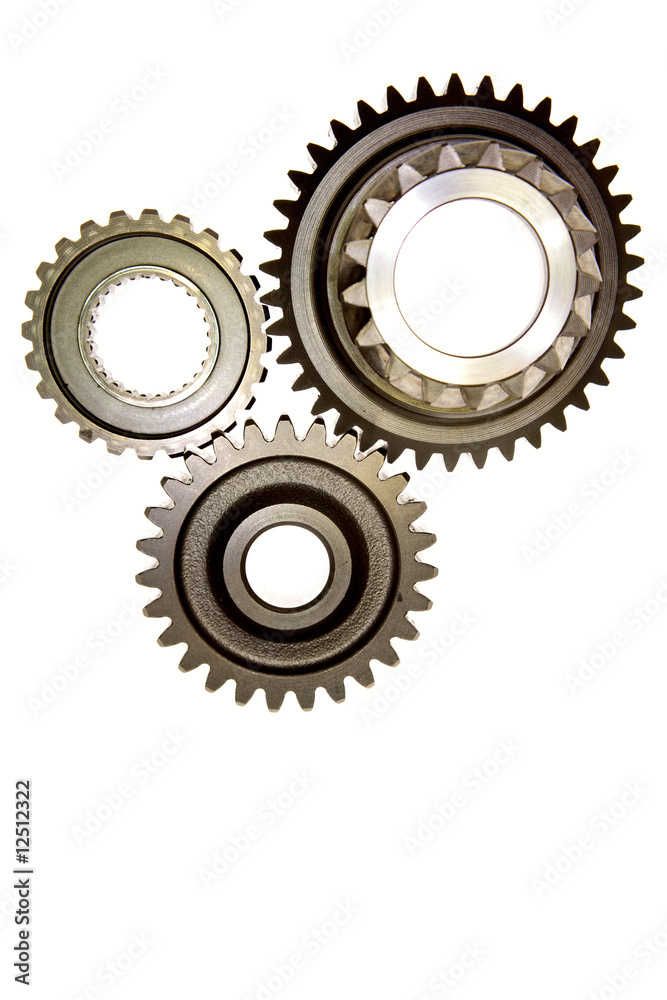 Three gears meshing together over white Three gears meshing together over white