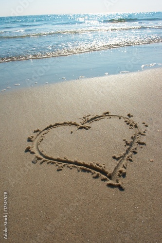 Heart drawn on sand  seacoast