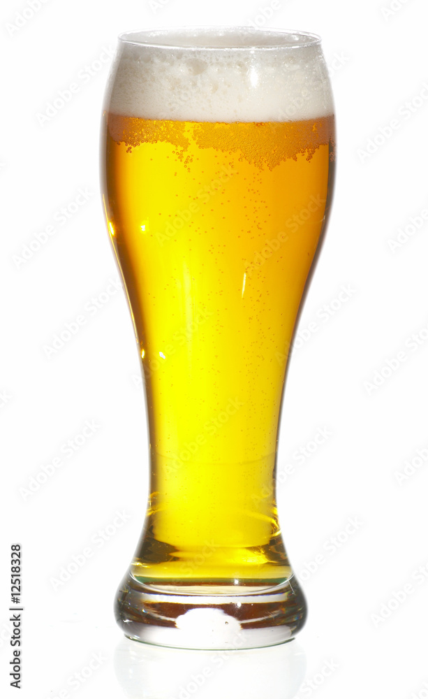 Glass of beer close-up with froth over white background