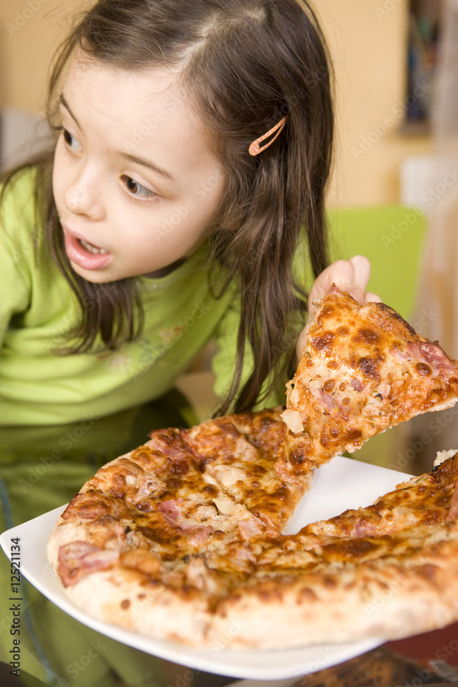 Child eating pizza