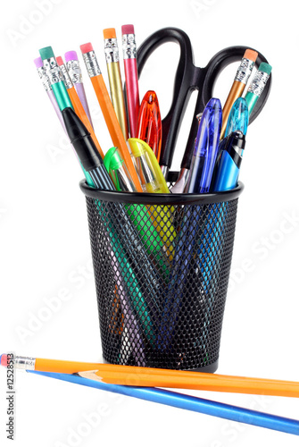 Full pencil cup with scissors, pencils and pens