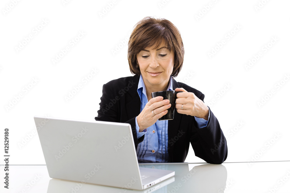 Senior businesswoman drinking coffe Senior businesswoman drinking coffe