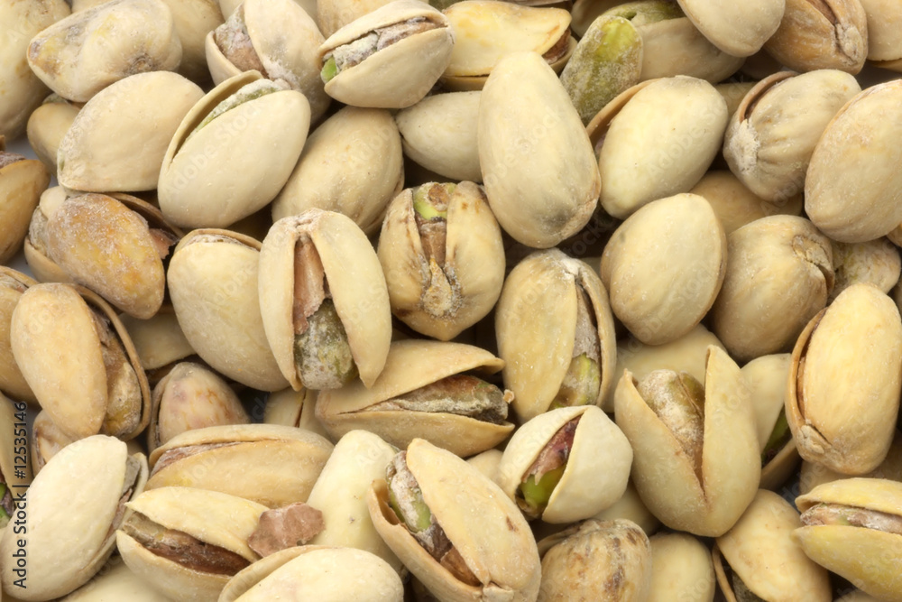 A nice view of pistachios nuts still in the shell ready to eat.