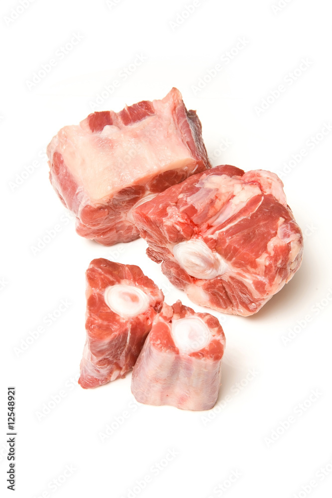 Ox tail meat chuncks isolated on a white studio background.