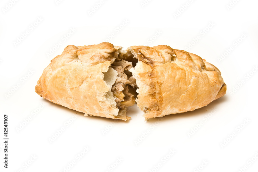 Cornish pasty isolated on a white studio background. Cornish pasty isolated on a white studio background.