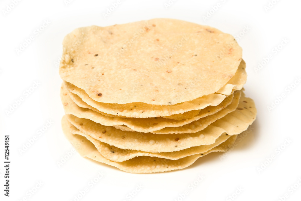 Pappadoms isolated on a white studio background. Pappadoms isolated on a white studio background.