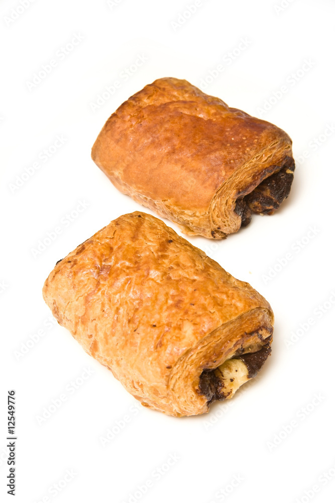 Chocolate croissant isolated on a white studio background.