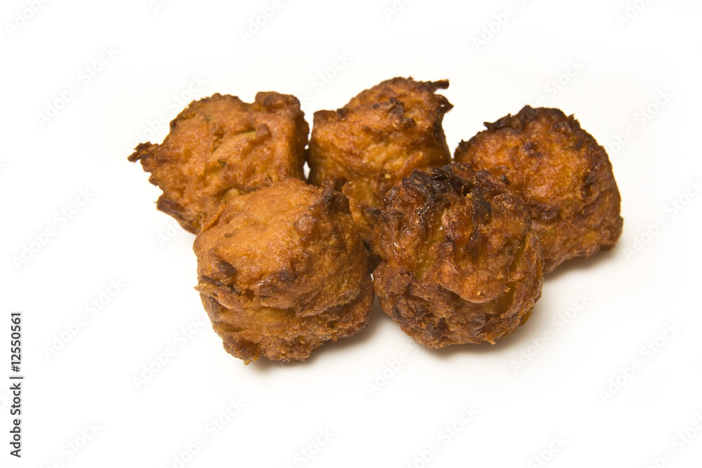 Onion Bhaji's isolated on a white studio background. Onion Bhaji's isolated on a white studio background.