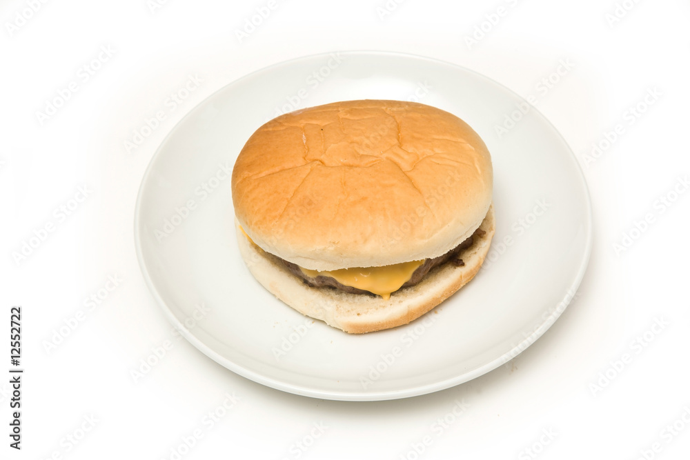 Cheeseburger isolated on a white studio background. Cheeseburger isolated on a white studio background.