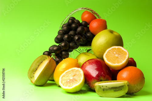 Fototapeta Naklejka Na Ścianę i Meble -  bright and juicy fruit on a green background