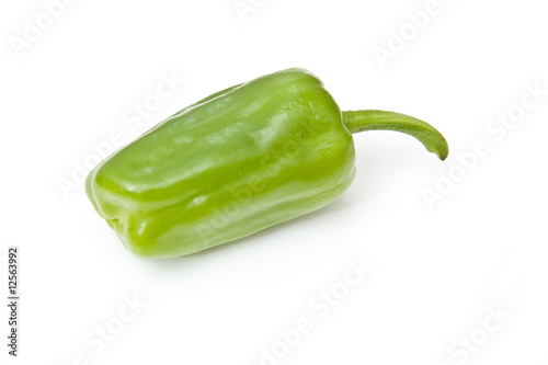 Green pepper isolated on a white studio background.