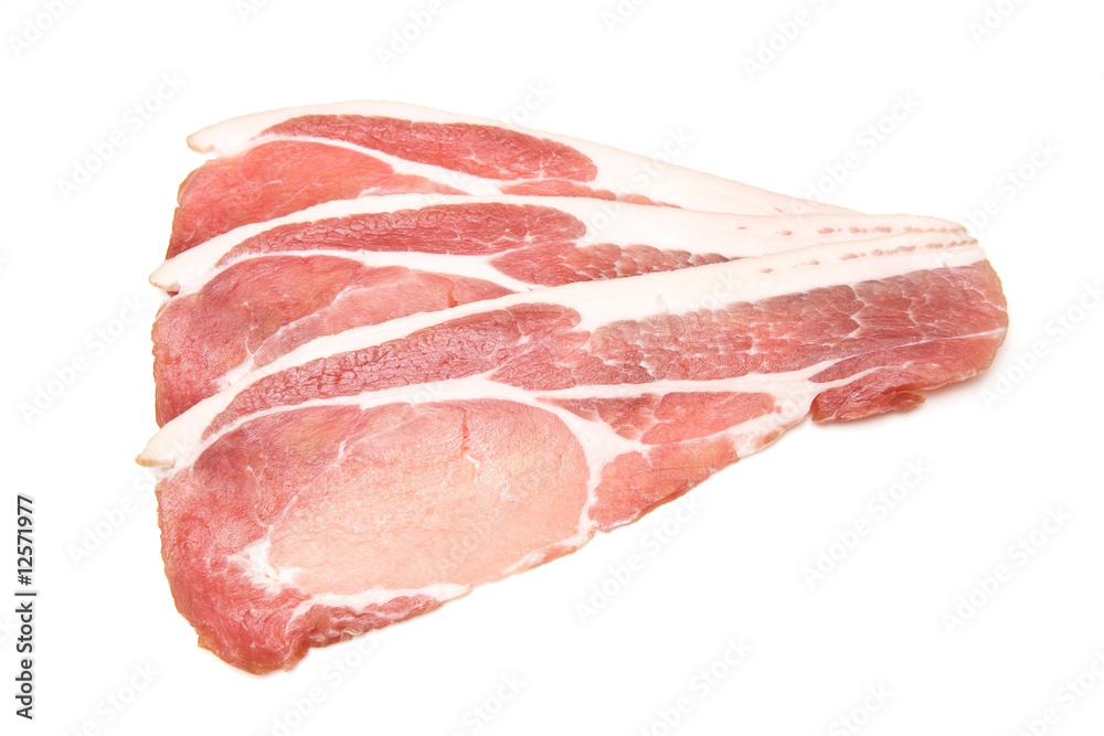 Rashers of bacon isolated on a white studio background. Rashers of bacon isolated on a white studio background.