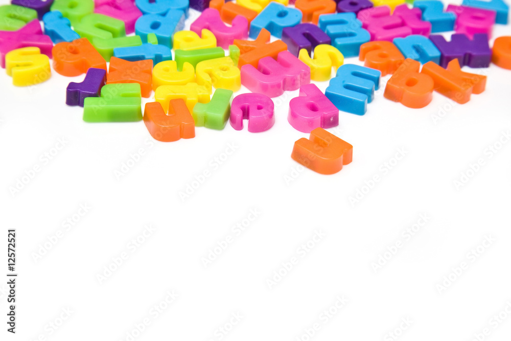 Magnetic letters isolated on a white studio background. Magnetic letters isolated on a white studio background.