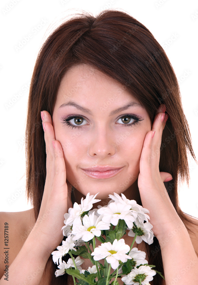 Beautiful young with flower. Facial massage. Beautiful young with flower. Facial massage.