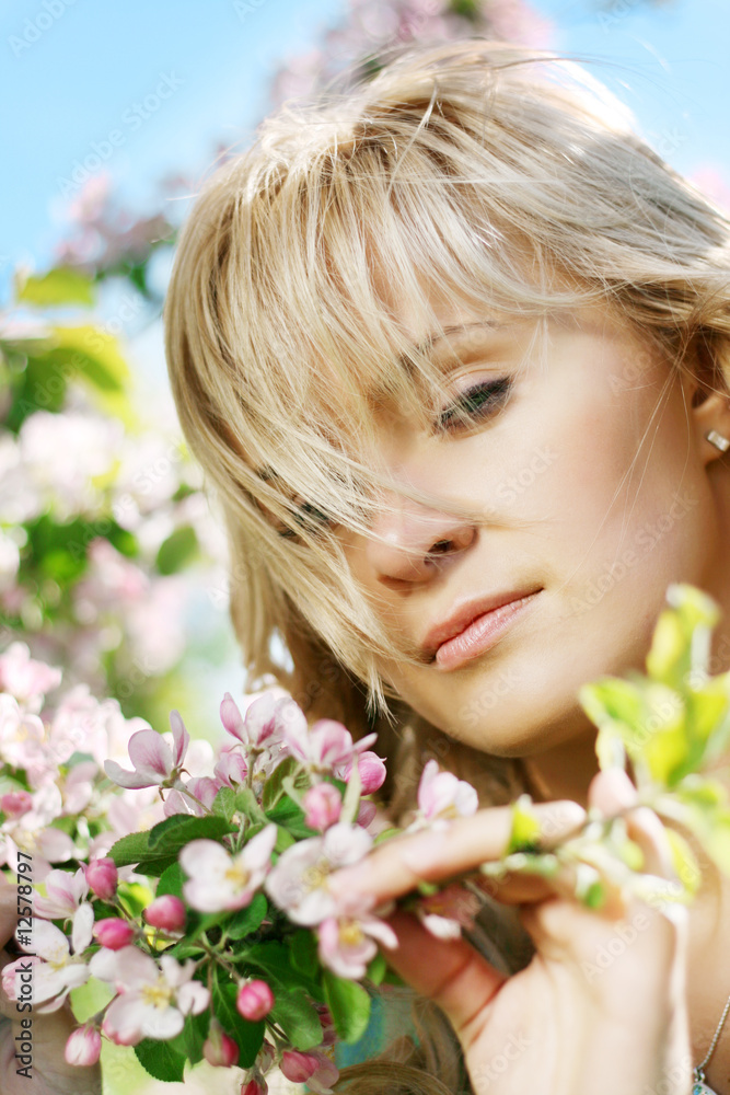Beautiful girl in a flowering garden Beautiful girl in a flowering garden