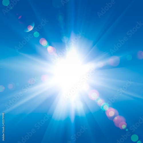 Sun rays against a blue sky