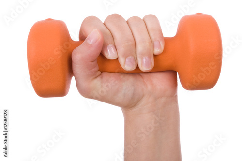 Female hand holding a dumbbell isolated on white