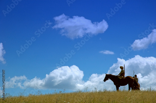 Horsemen archers in steppe landscape