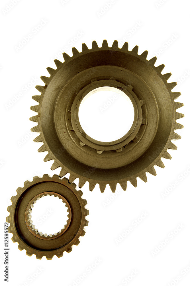 Two gears meshing together over white Two gears meshing together over white