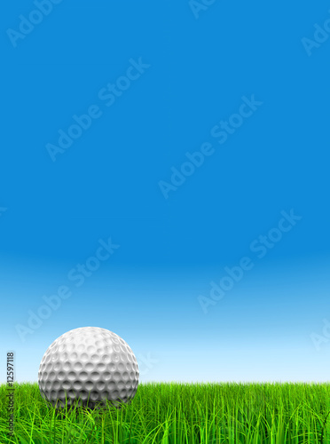 3d white golf ball in green grass on a clear blue sky background