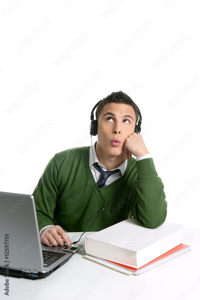 Young man student, computer, music headphones Young man student, computer, music headphones