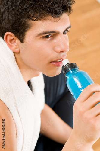 Athletic man drinking energy drink