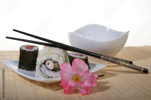 Sushi plate with chopsticks and flower