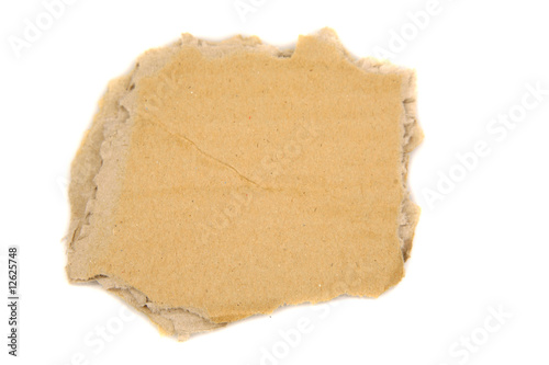 Piece of torn cardboard isolated over white background