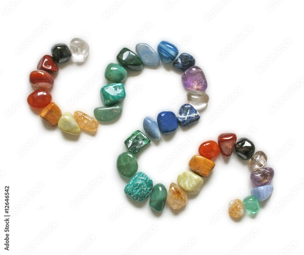 Coloured curved lines of crystal healing stones Coloured curved lines of crystal healing stones