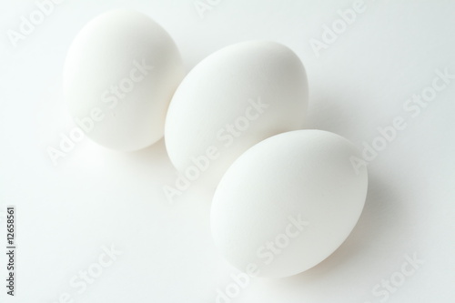 three eggs on white