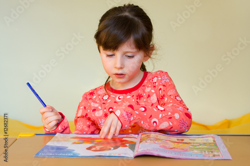 Girl reading magazine