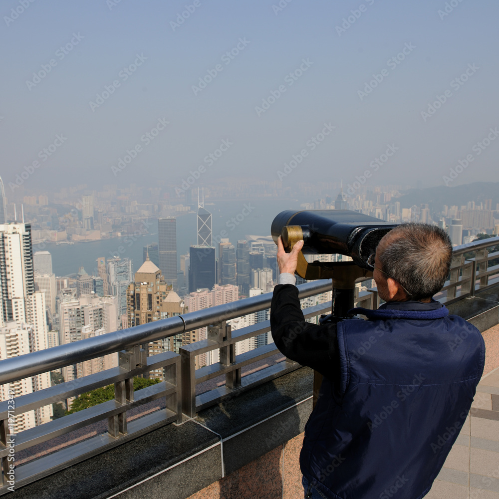 Tourist looking in Telescope