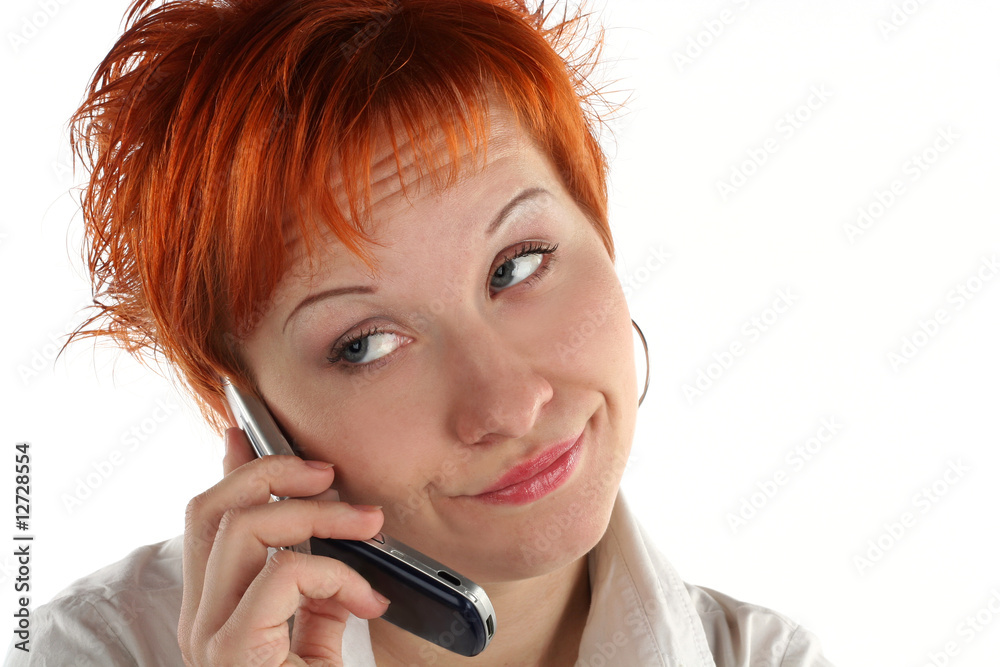 red haired woman talking by mobile phone unhappy red haired woman talking by mobile phone unhappy