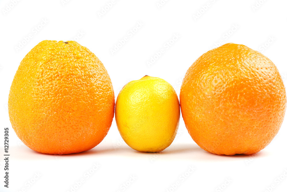 Two orange oranges and one yellow lemon Two orange oranges and one yellow lemon