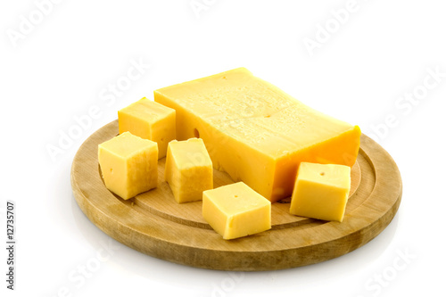 Wooden plate with cheese