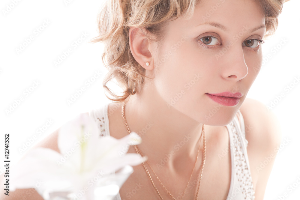 Portrait of attractive blond girl with white lily