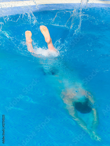 Man splashing into blue water