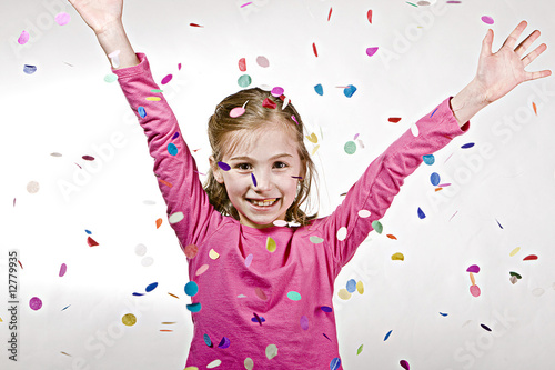 Child celebrating with confetti