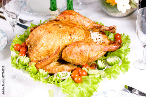 Feasting backed turkey on holiday table ready to eat